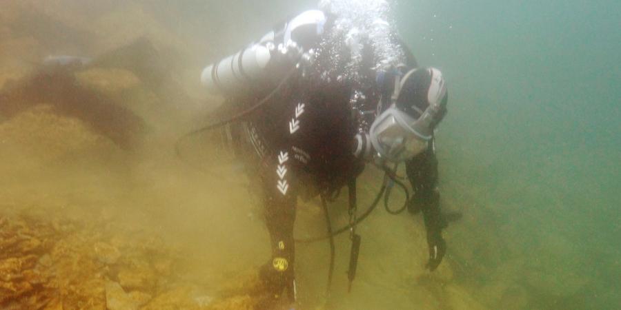 Diver investigating a heritage asset as part of the Scottish Underwater Diving Services