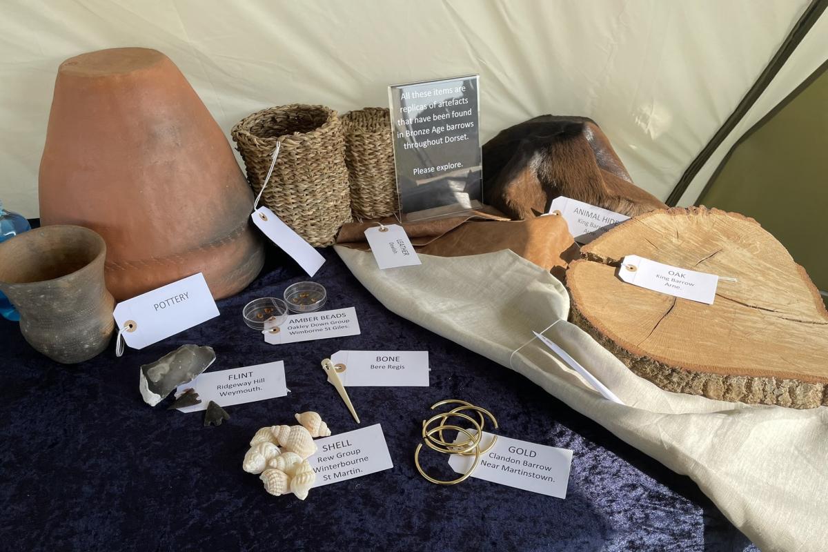 Replica artefacts displayed for handling at Badbury Rings Festival of Archaeology event
