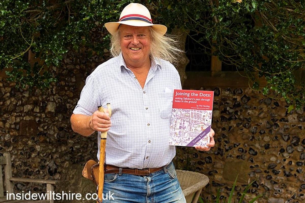 Dr Phil Harding holds the cover of his new book 'Joining the dots'