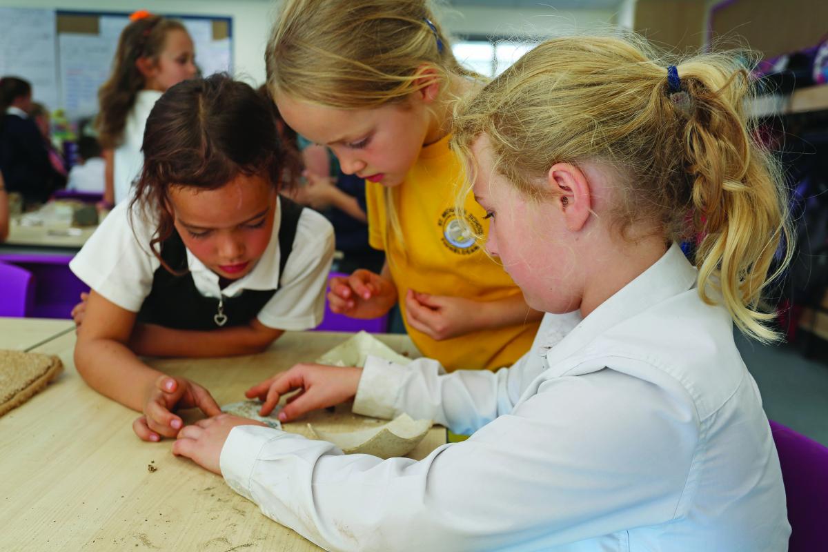 School children learning about archaeology and heritage