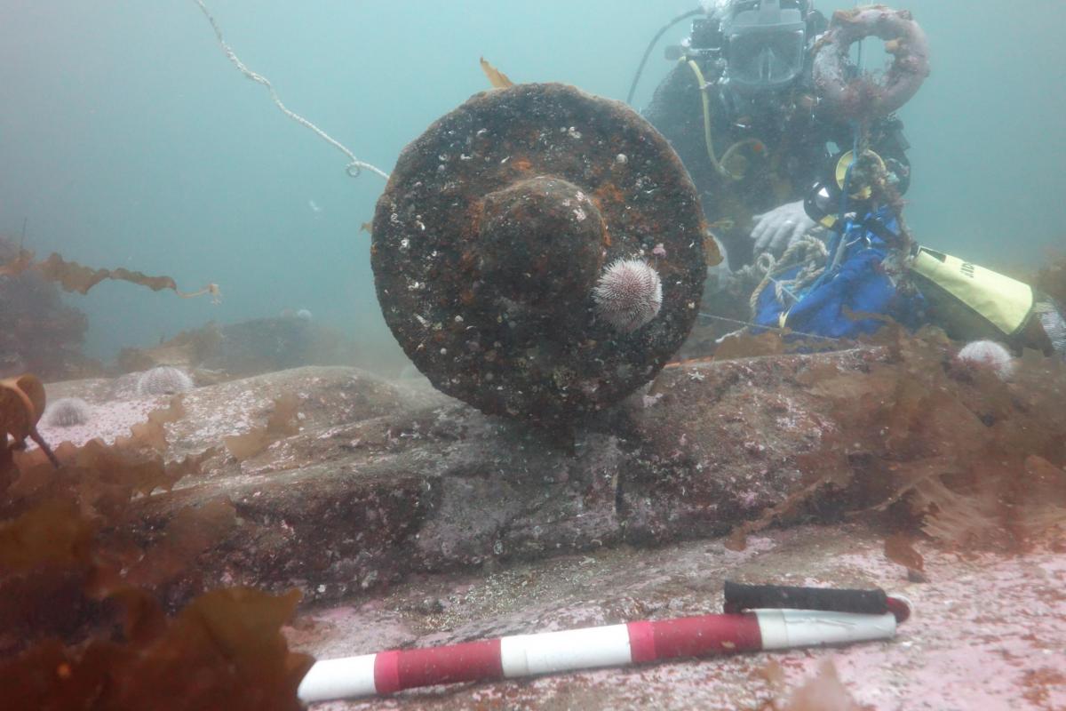 Wessex Archaeology diver documenting a cannon on the Queen of Sweden wreck site