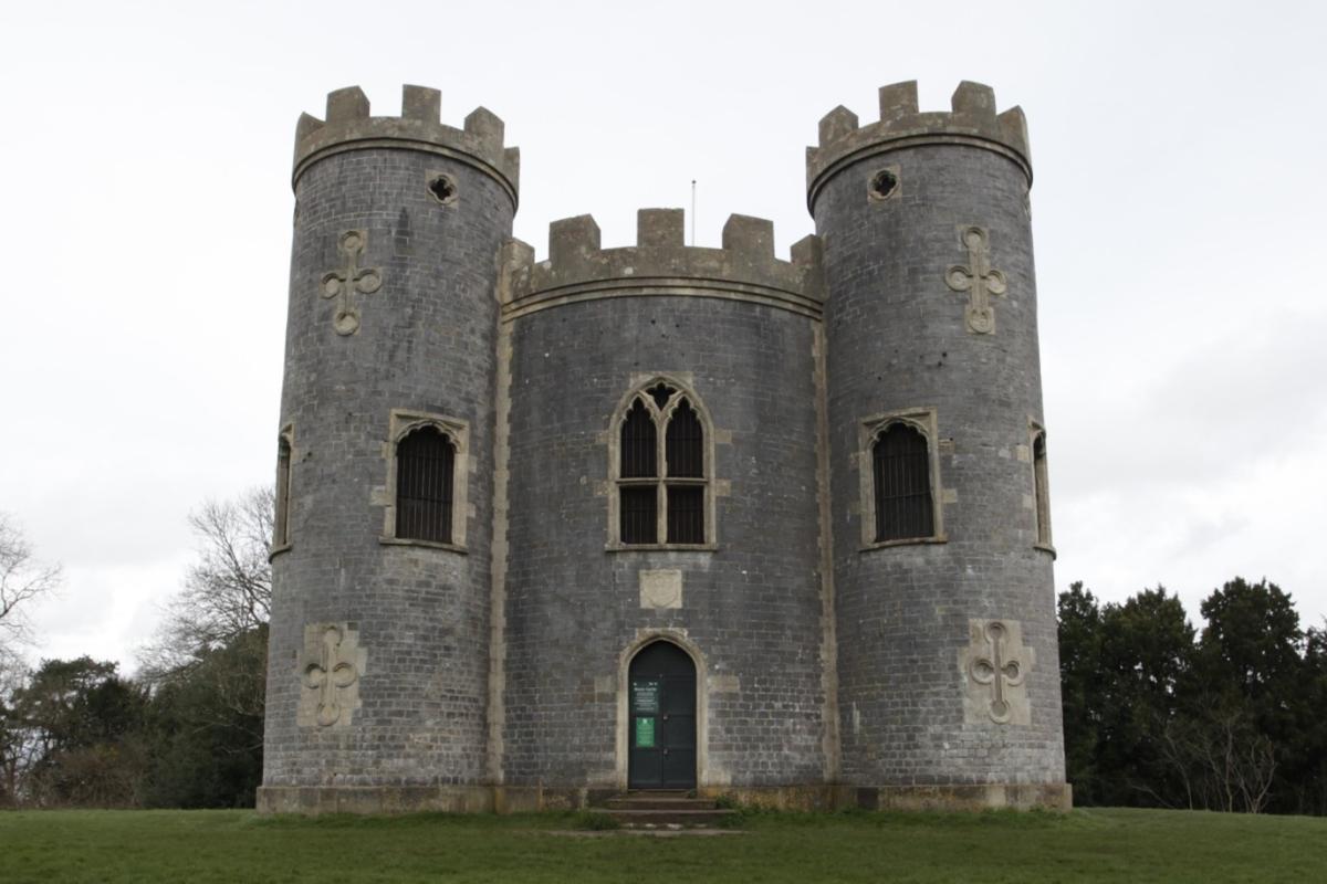 A folly or sham castle is shown with tall grey turrets. It mimics the medieval style, but was built in the 18th century.