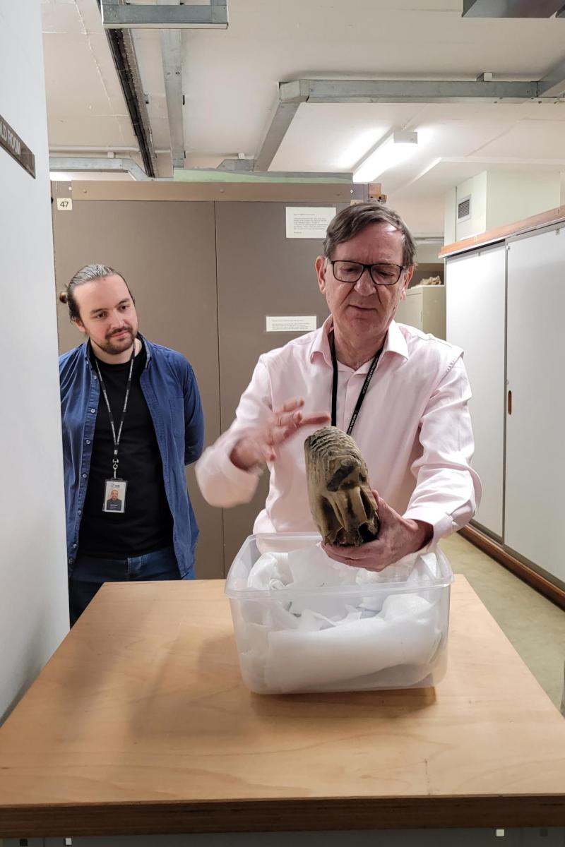 Adrian Lister and Neil Adams from the Natural History Museum examining the mammoth tooth