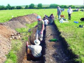Excavating an evaluation trench at Brancaster